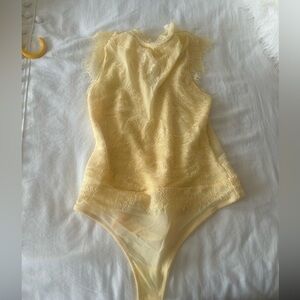 Free people Lace Bodysuit in yellow. Brand new with tags